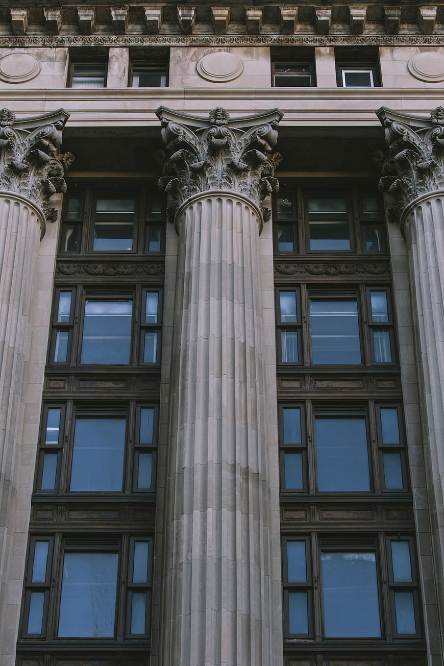 Classic Architecture with Ornate Corinthian Columns and Windows