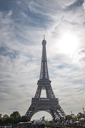Eiffel Tower in Paris Against Cloudy Sky