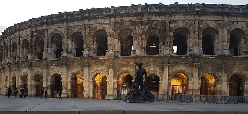 Arles Amphitheatre at Dusk with Foreground Statue