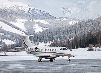Private Jet on Snowy Runway in Swiss Alps