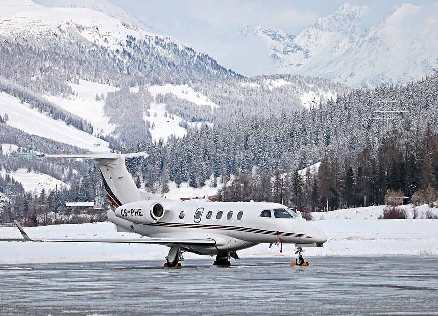 Private Jet on Snowy Runway in Swiss Alps