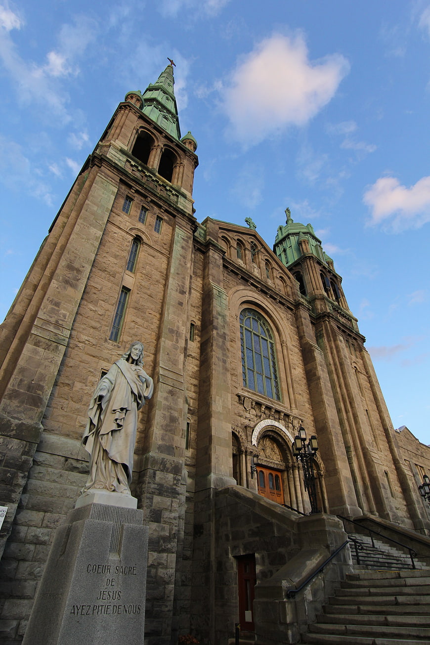 Low angle view of historic stone cathedral with statue