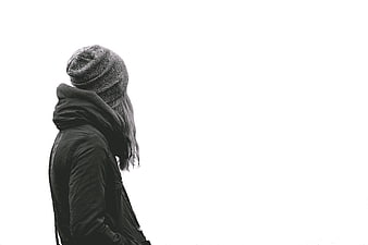 Woman in Beanie and Jacket Looking Away on White Background