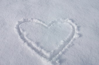 Heart drawn in fresh white snow