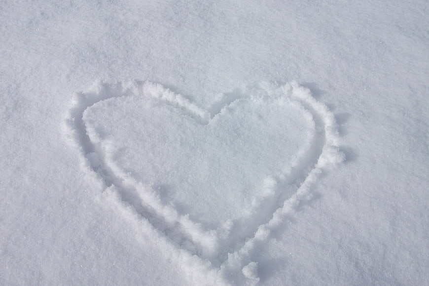 Heart drawn in fresh white snow