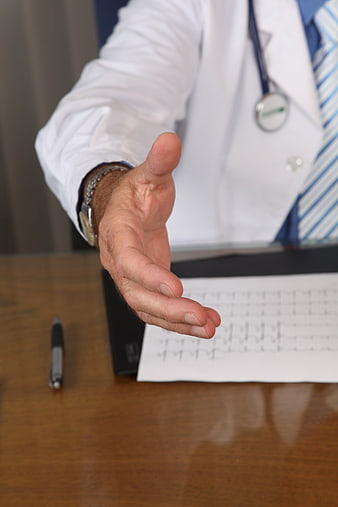 Doctor Handshake with Stethoscope and ECG Chart