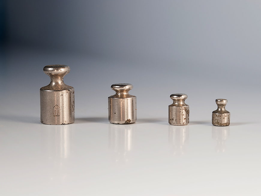 Vintage Soviet Calibration Weights Arranged in Descending Size