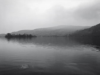 Moody Black and White Lake Landscape with Foggy Mountains