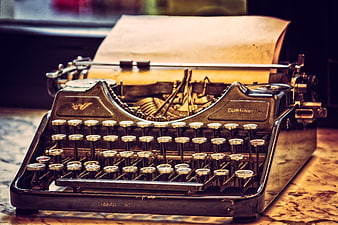 Vintage Continental Typewriter With Paper On Wooden Desk