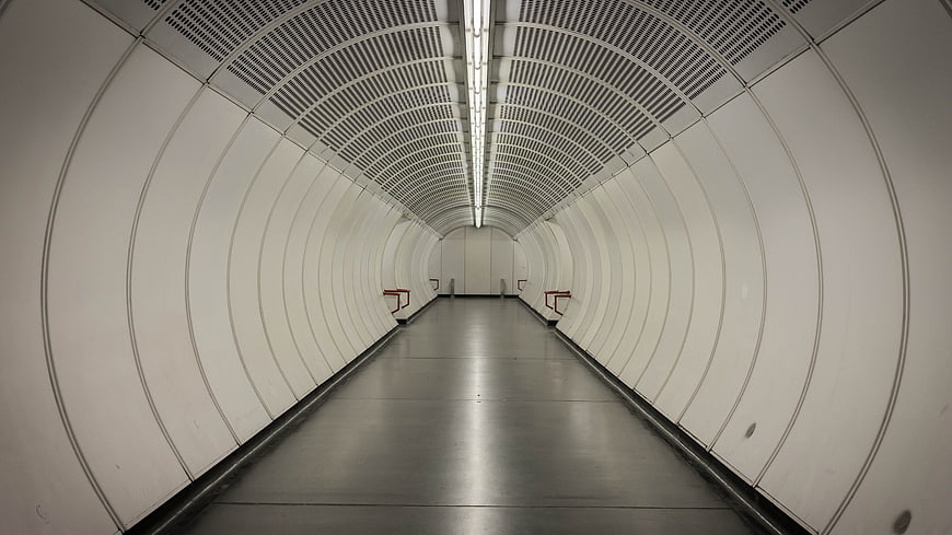 Empty White Subway Tunnel Corridor With Symmetrical Perspective