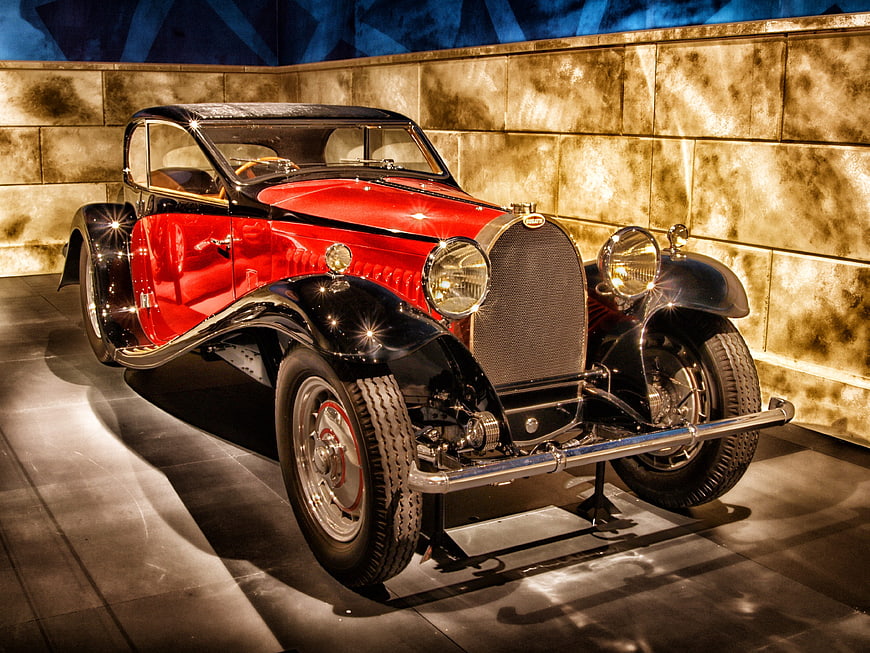 Vintage Red and Black Bugatti Classic Car in Museum