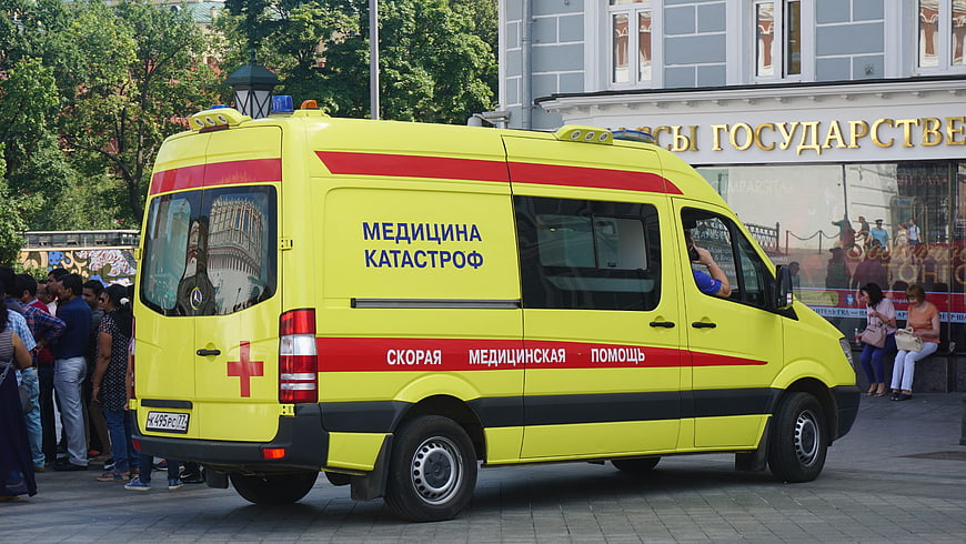 Yellow Russian Ambulance Van Parked on City Street