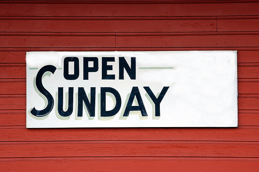 Open Sunday Sign On Red Wooden Wall