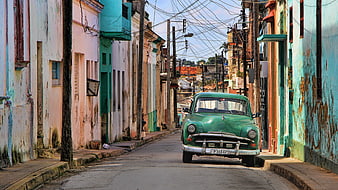 Vintage Green Car Parked on Colorful Havana Street