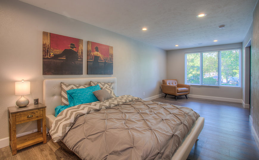 Modern Bedroom Interior with Turquoise Accents and Art