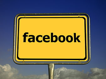 Yellow Facebook Sign Against Blue Sky