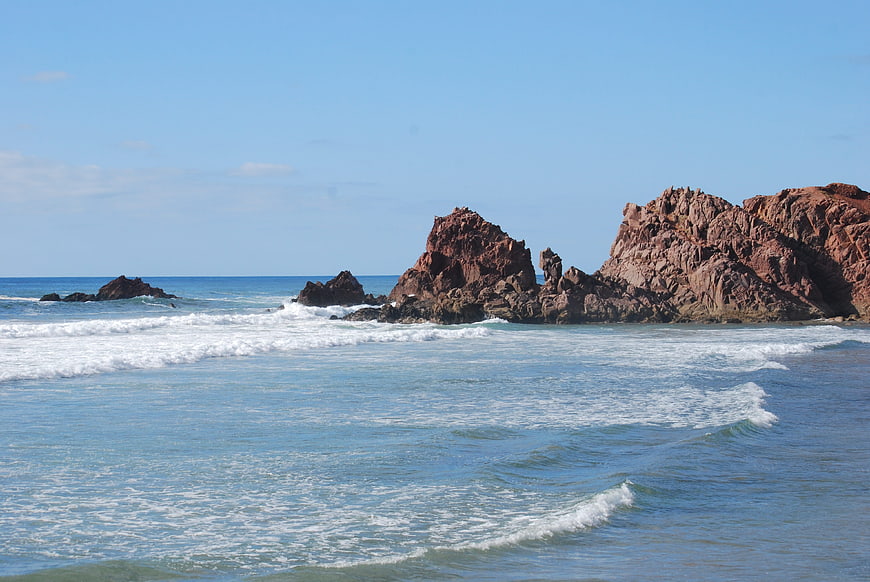 Red Rock Formations on a Sunny Coastal Beach