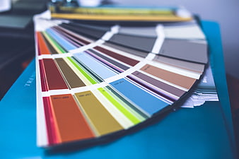Color swatch fan deck on blue design folder