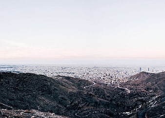 Panoramic View of City from Mountain Ridge at Dusk