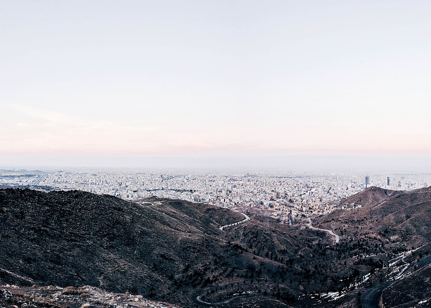 Panoramic View of City from Mountain Ridge at Dusk
