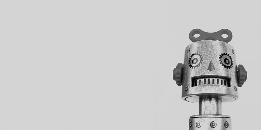 Retro Silver Robot Toy Head on Gray Background