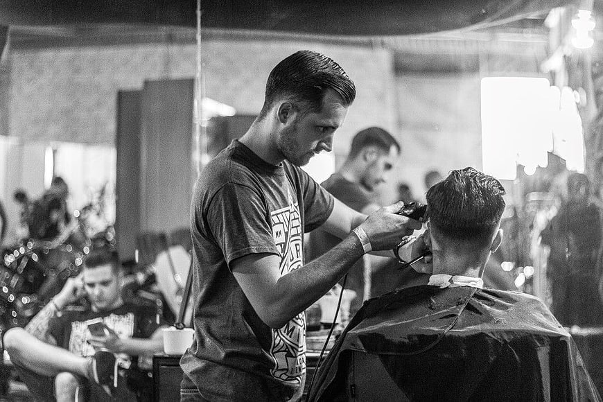 Barber Cutting Hair in Black and White
