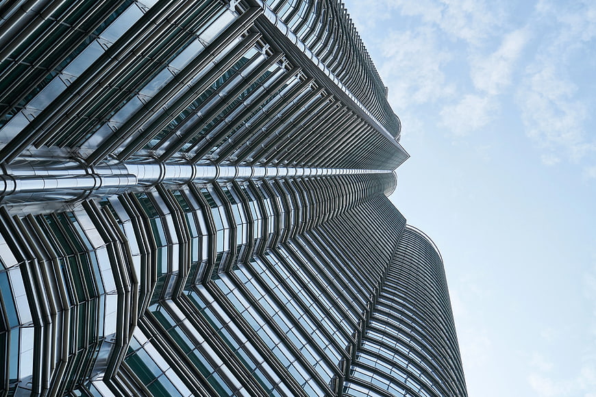 Low angle view of modern glass skyscraper architecture