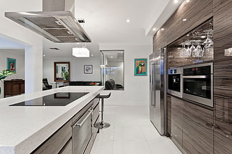 Modern kitchen interior with island and stainless steel appliances