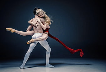 Ballet Dancers in Dramatic Embrace with Red Fabric
