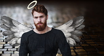 Handsome bearded man with angel wings and halo