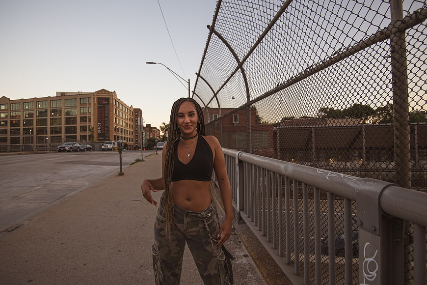 Stylish woman in urban street portrait at dusk