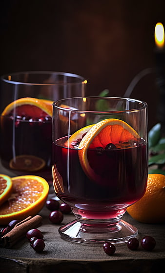 Glasses of mulled wine with orange slices and cranberries