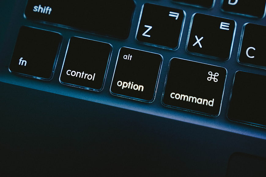 Close-up of MacBook keyboard with command, option, and control keys