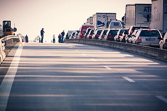 Traffic Jam on Highway with Empty Lane and People