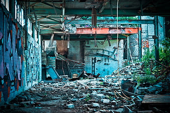 Abandoned Industrial Building Interior with Graffiti and Rubble