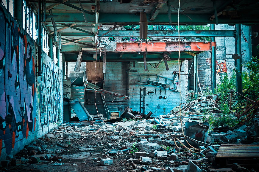 Abandoned Industrial Building Interior with Graffiti and Rubble