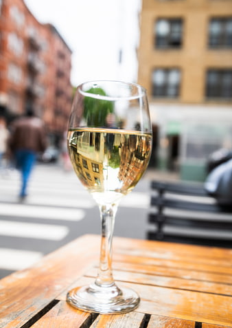 Glass of White Wine on Outdoor Wooden Table