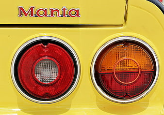 Close-up of yellow Manta car rear lights and emblem
