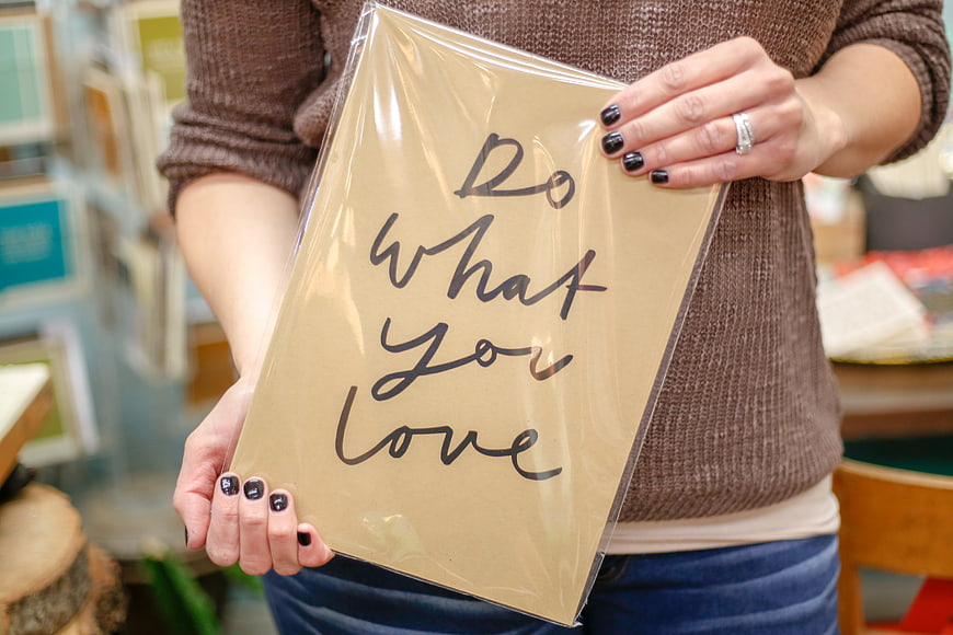 Woman holding inspirational quote Do What You Love print