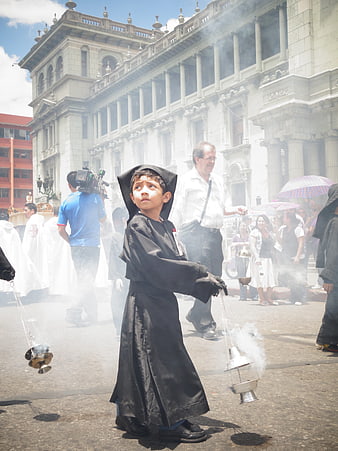 Young Altar Boy Swinging Censer During Holy Week Procession