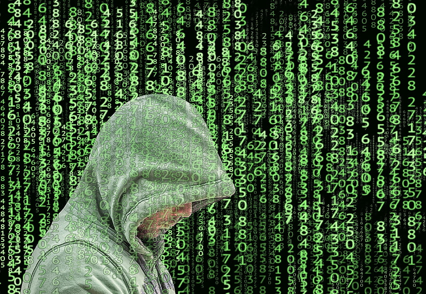 Hacker in Hoodie with Green Digital Code Overlay