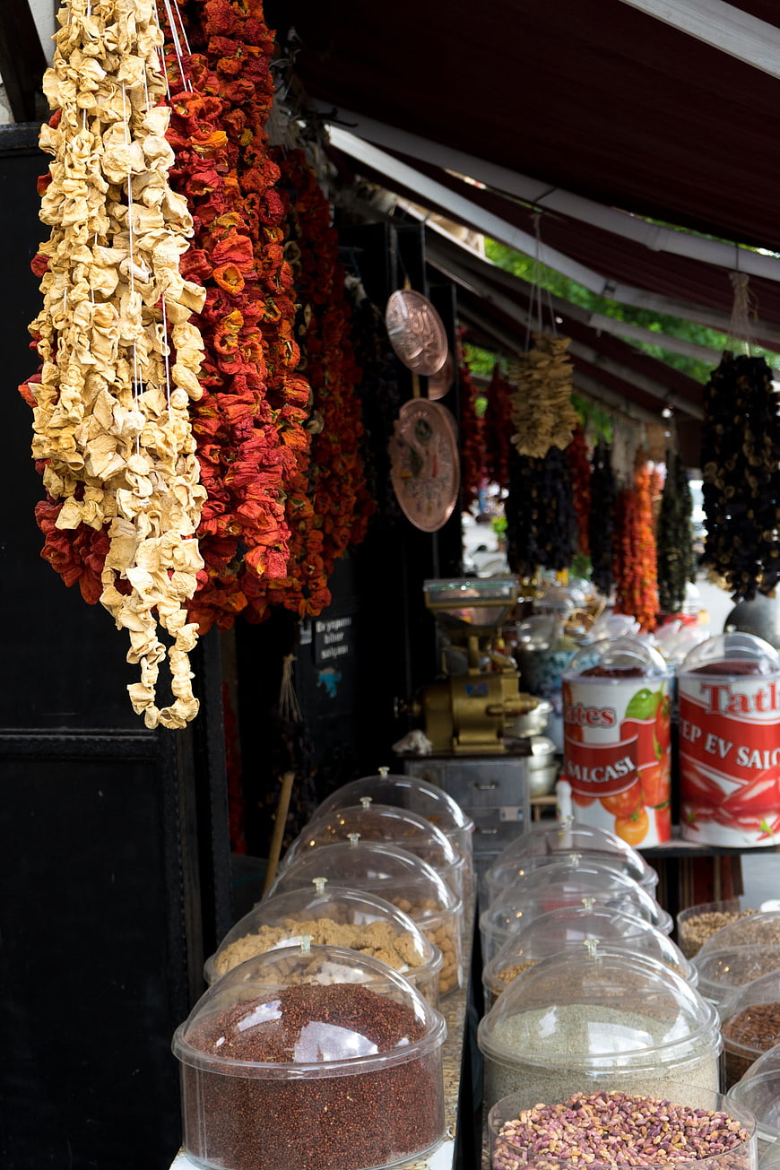 Dried peppers and spices hanging in a Turkish market stall