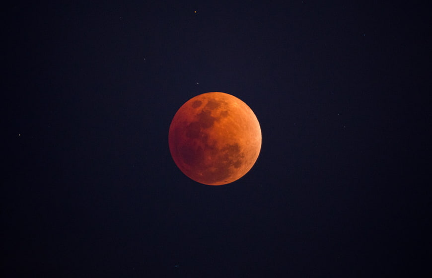 Blood Moon Eclipse Against Dark Night Sky
