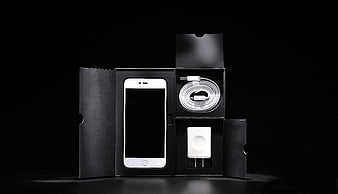 White Smartphone Unboxing with Charger and Cable in Black Box