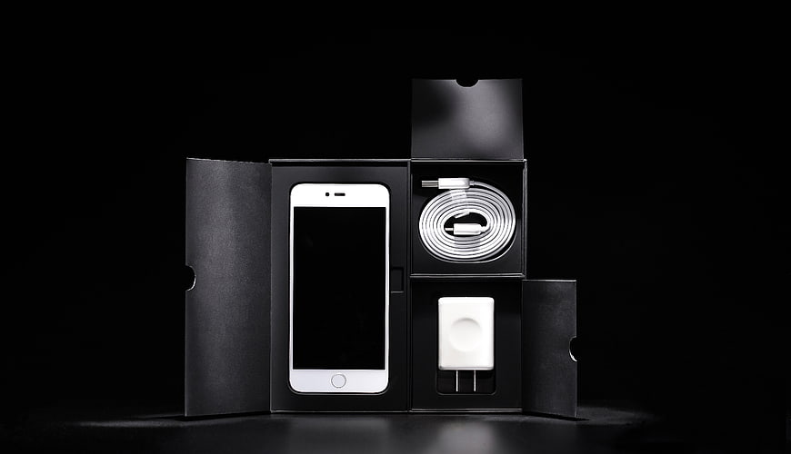 White Smartphone Unboxing with Charger and Cable in Black Box