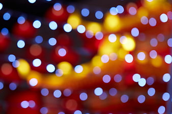 Abstract Bokeh Background with Festive Red, Yellow, and Blue Lights