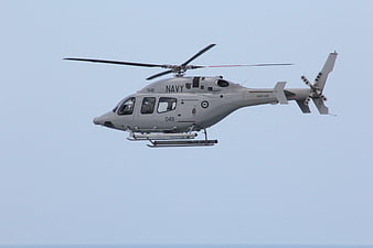 US Navy MH-60S Seahawk Helicopter Flying in Blue Sky