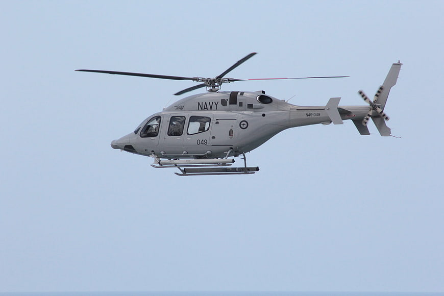 US Navy MH-60S Seahawk Helicopter Flying in Blue Sky