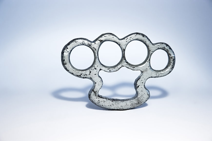 Vintage Metal Brass Knuckles on White Background