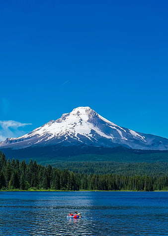 Snow-Capped Mountain Lake with Kayakers